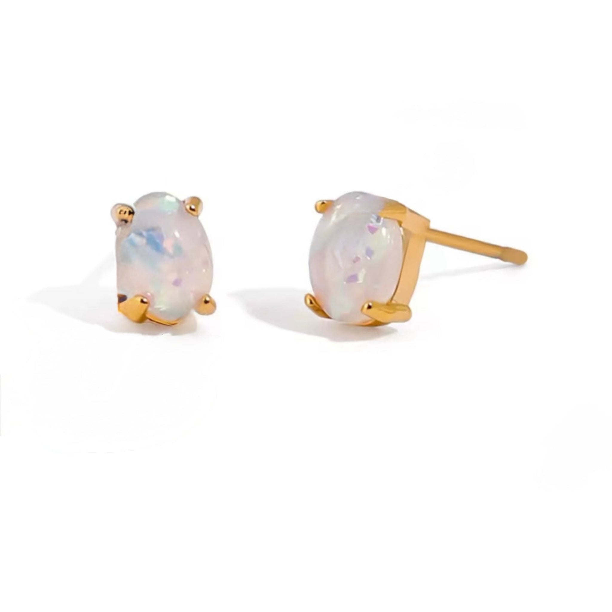 Pair of opal stud earrings with gold settings on a white background
