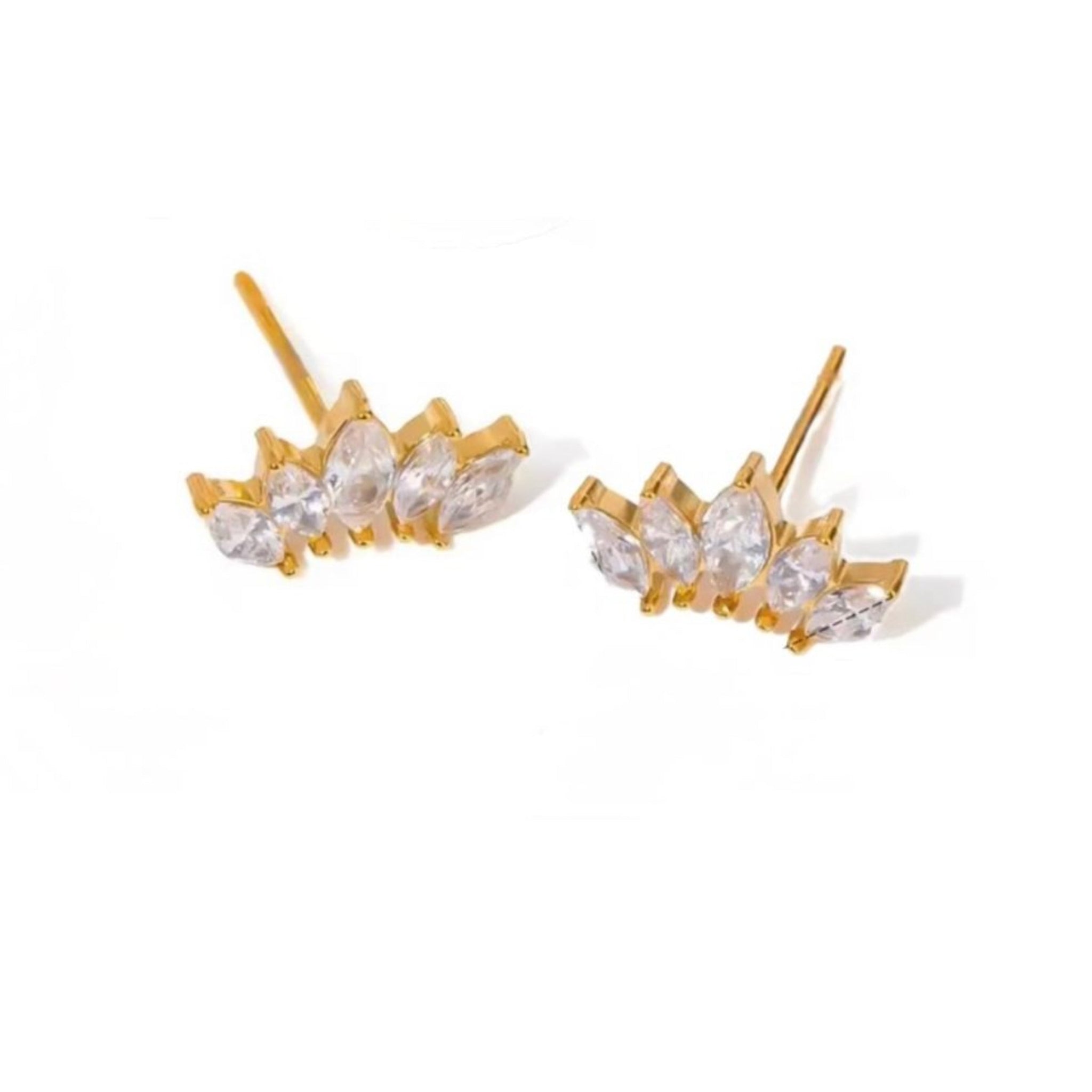 Gold earrings with clear stones on a white background