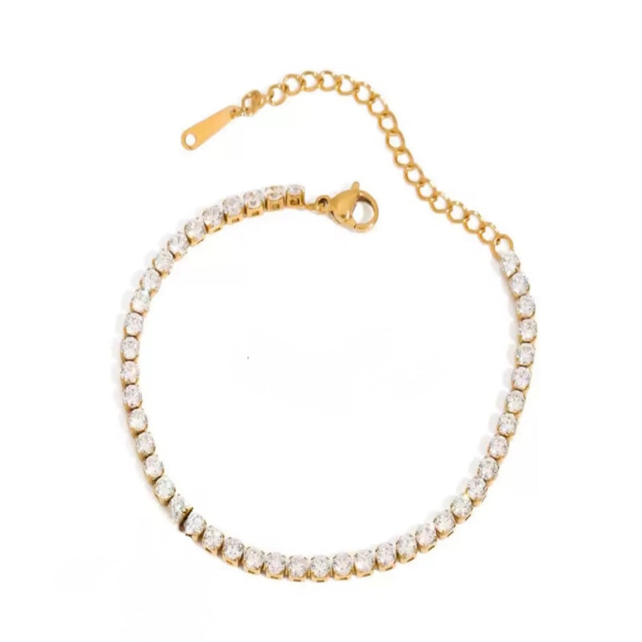 Gold bracelet with cubic zirconia on a white background