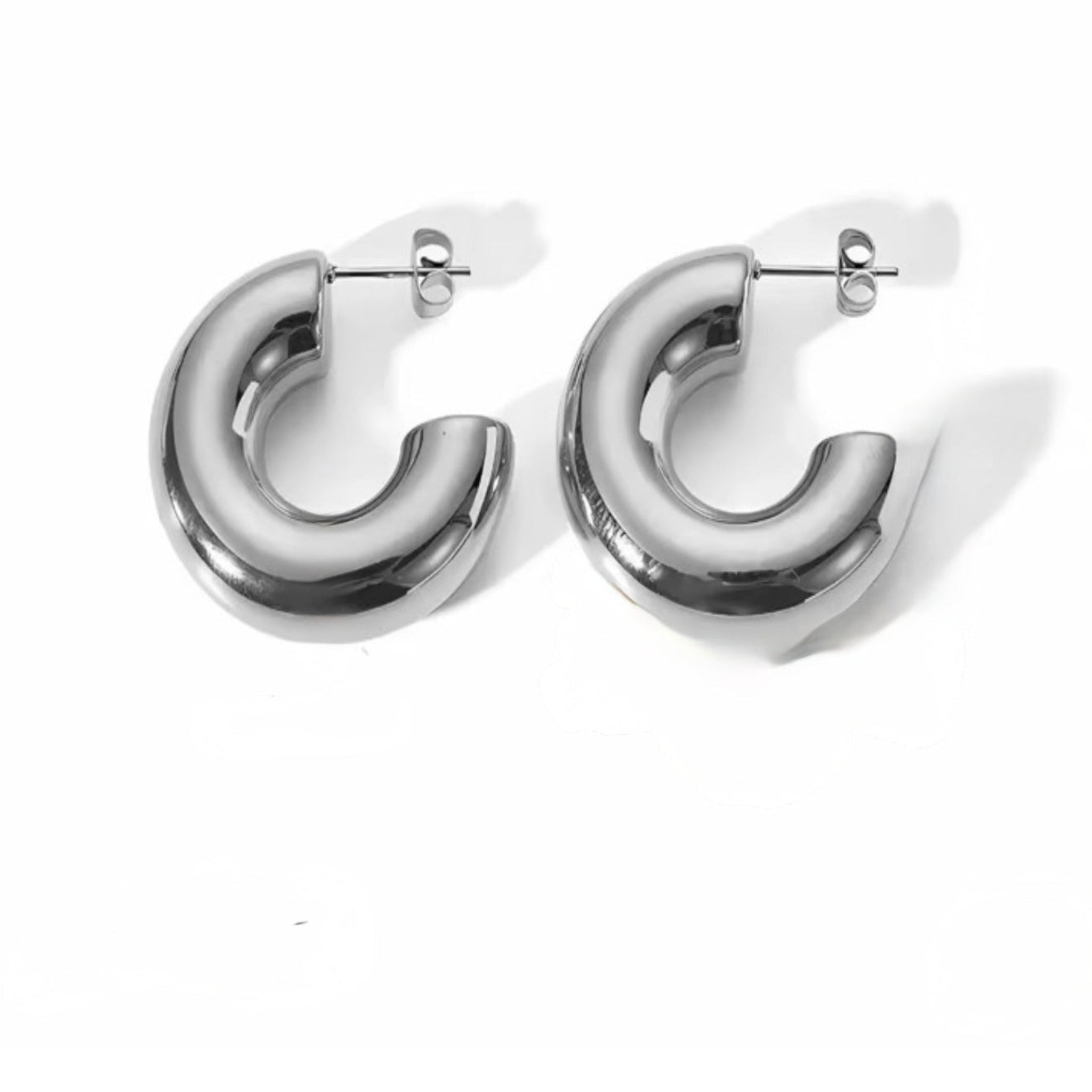 Pair of silver hoop earrings on a white background