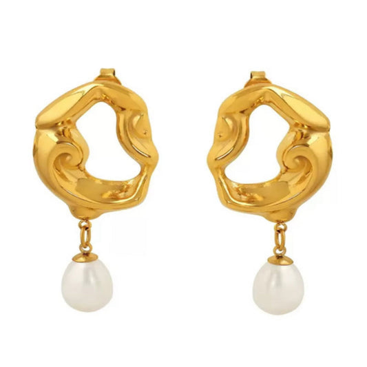 Gold earrings with pearl drops on a white background
