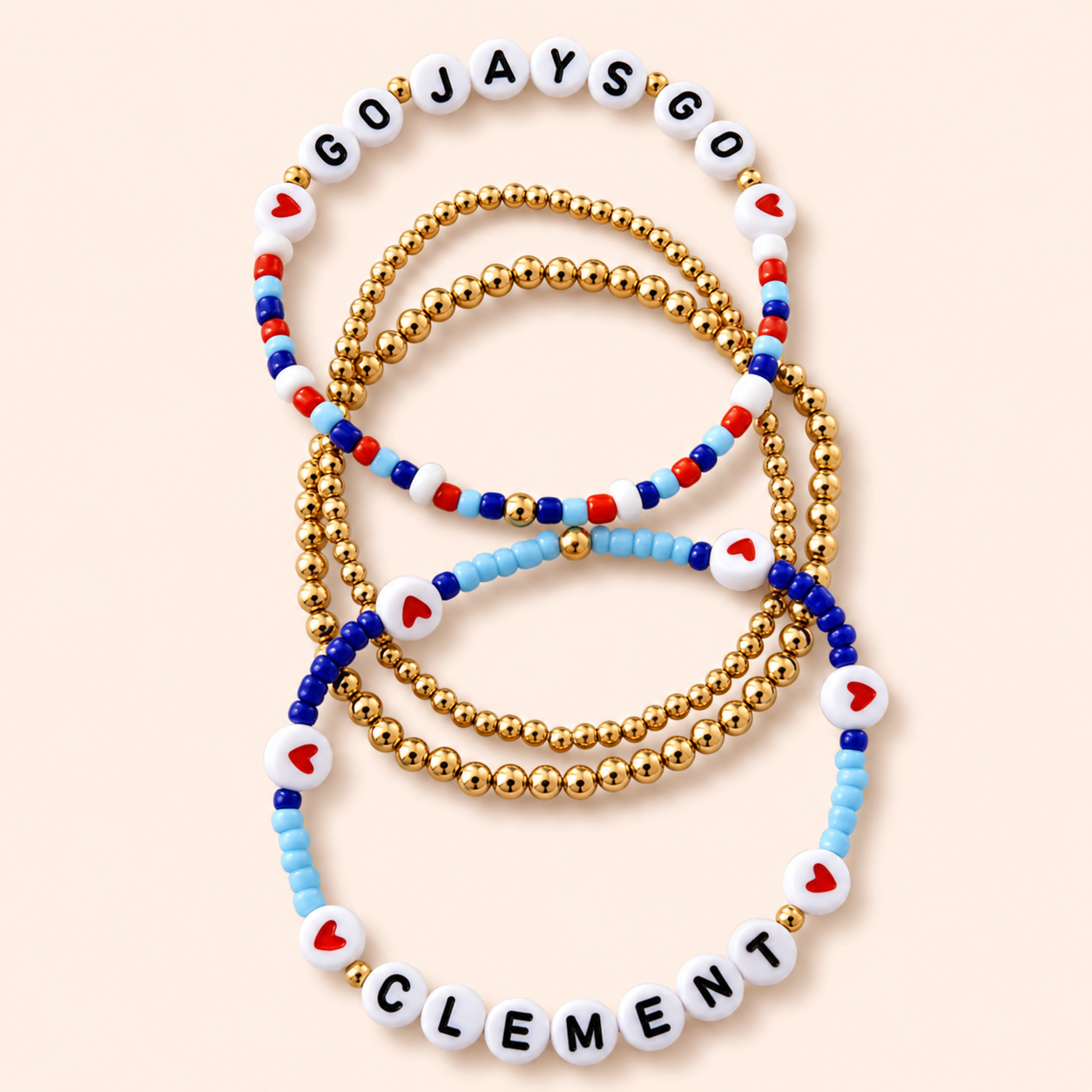 Clement four-piece Blue Jays bracelet set with red, blue, white and gold beads
