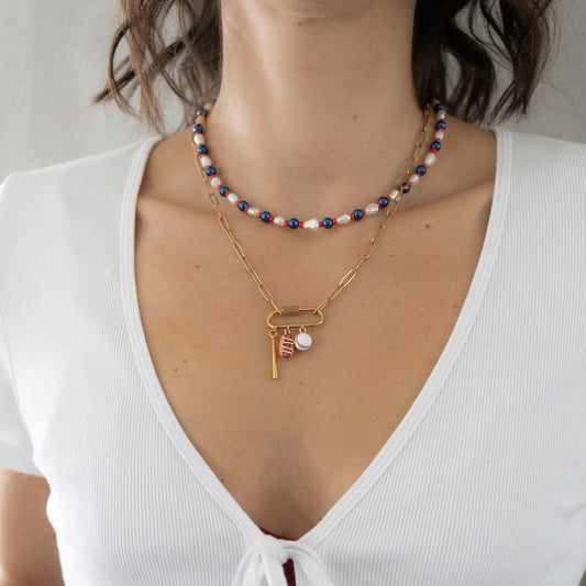 Necklace with sports pendants on it. 