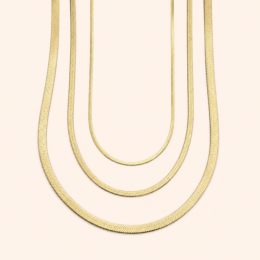Gold herringbone necklaces in 2mm, 3mm and 4mm widths for layering