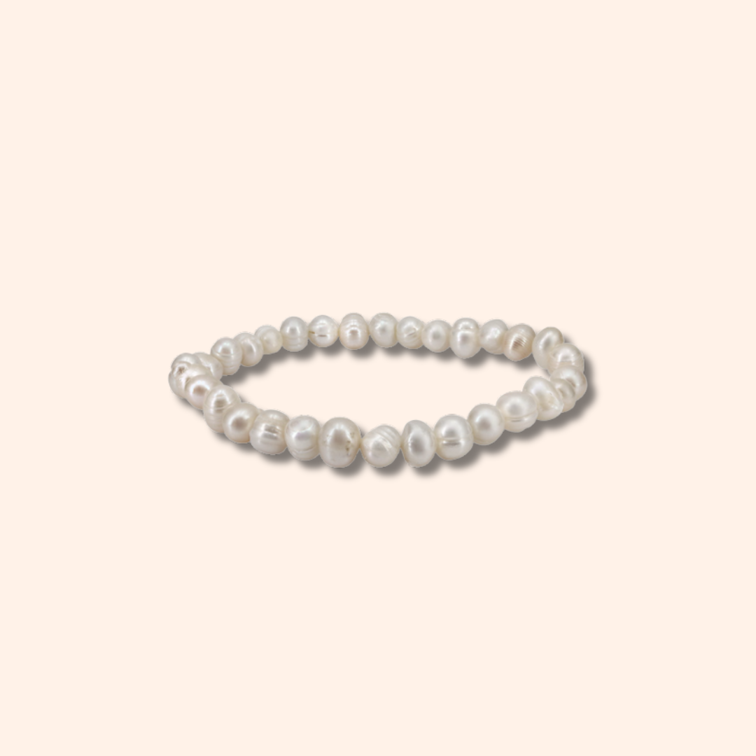 Pearl bracelet on a light beige background