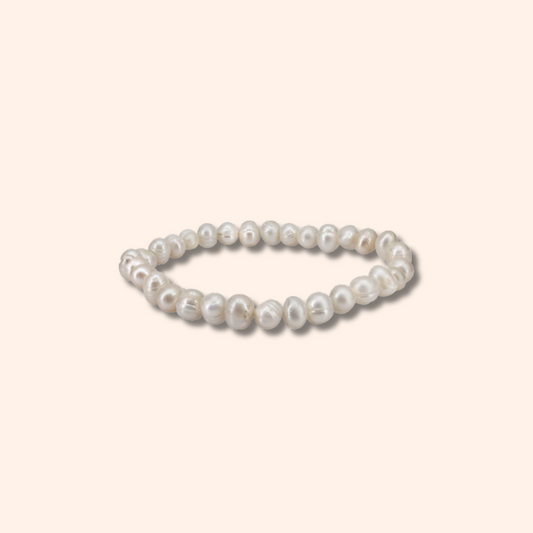 Pearl bracelet on a light beige background