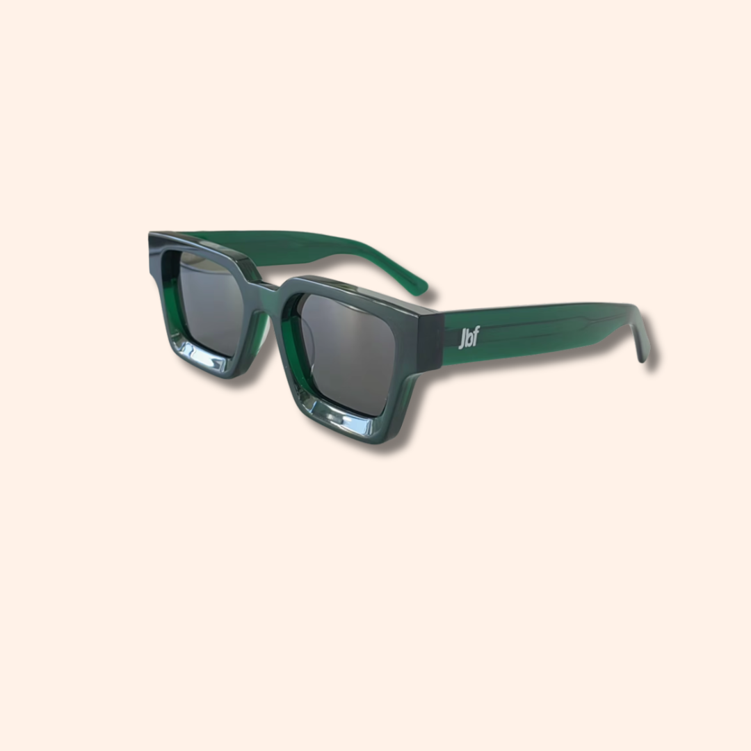 Green sunglasses with a brand logo on a beige background