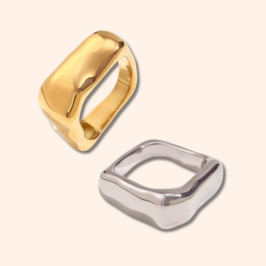 Gold and silver rings on a light beige background