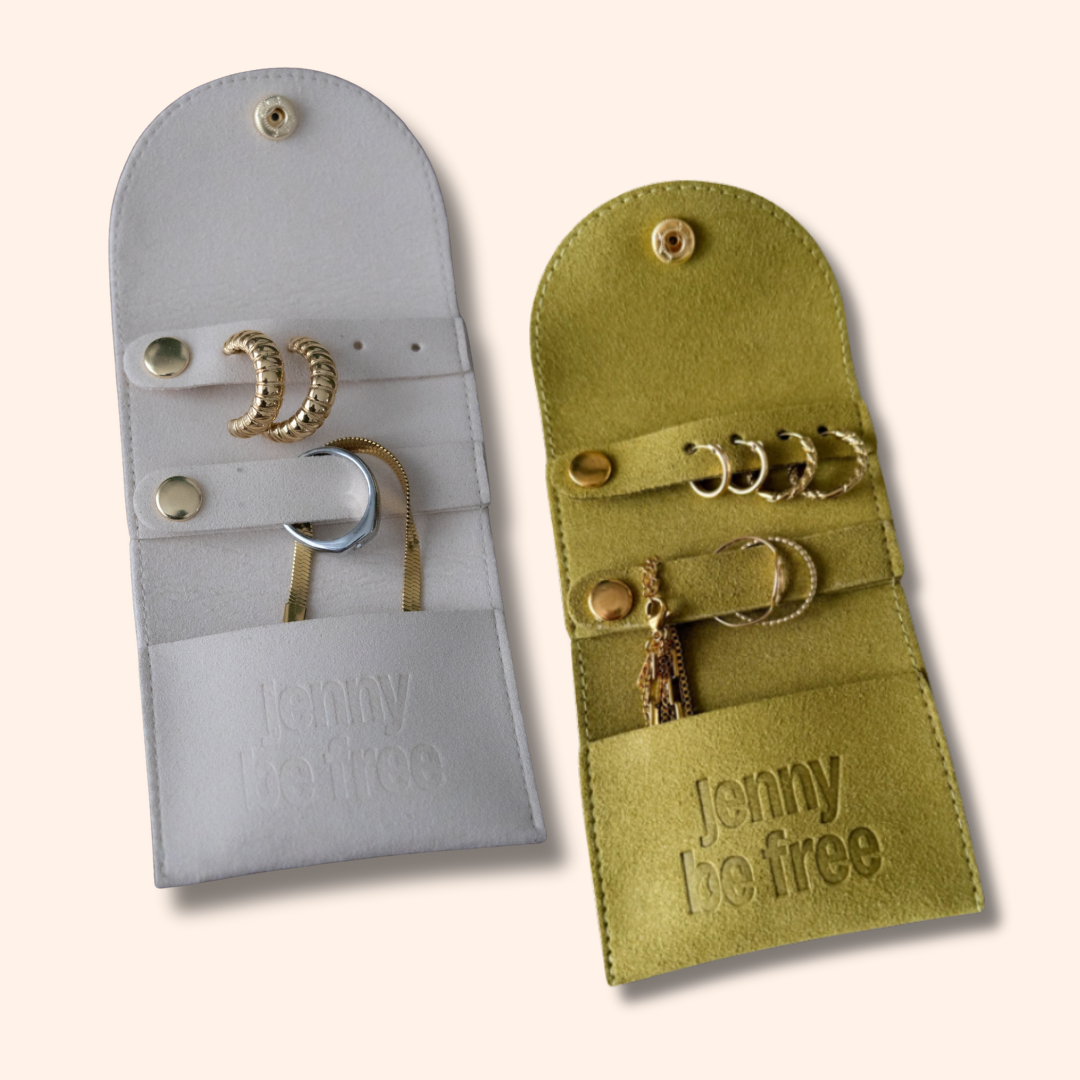 Two jewelry pouches, one gray and one green, with 'Jenny Be Free' branding on a white background.