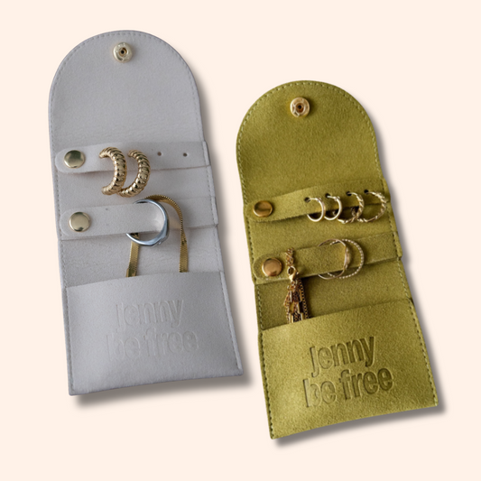 Two jewelry pouches, one gray and one green, with 'Jenny Be Free' branding on a white background.