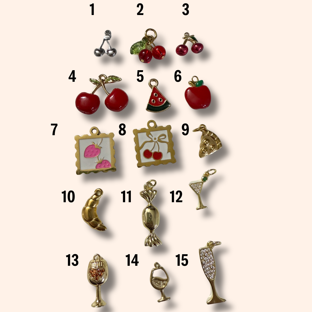 Collection of various small charms on a beige background