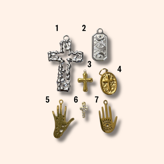 Collection of various pendants on a beige background