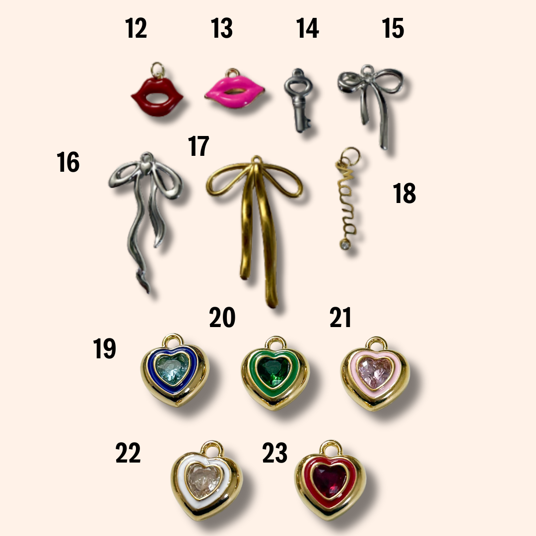 Collection of various jewelry charms on a beige background