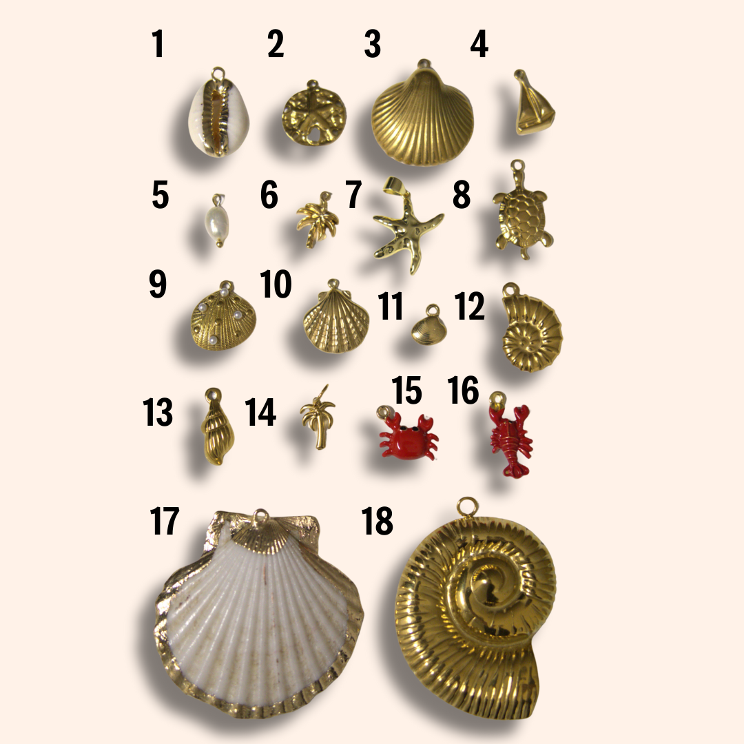 Collection of various shell-shaped pendants on a beige background
