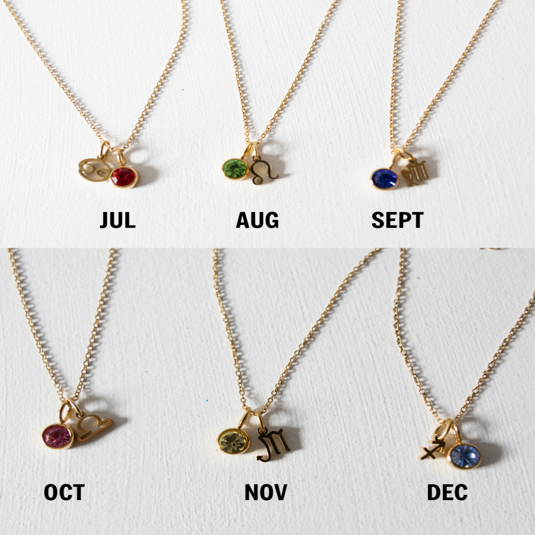 Necklace set with birthstone charms for each month on a white background