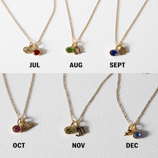 Necklace set with birthstone charms for each month on a white background